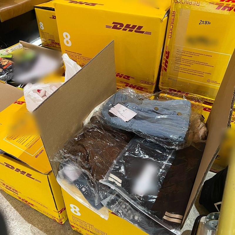 DHL boxes being packed for shipping